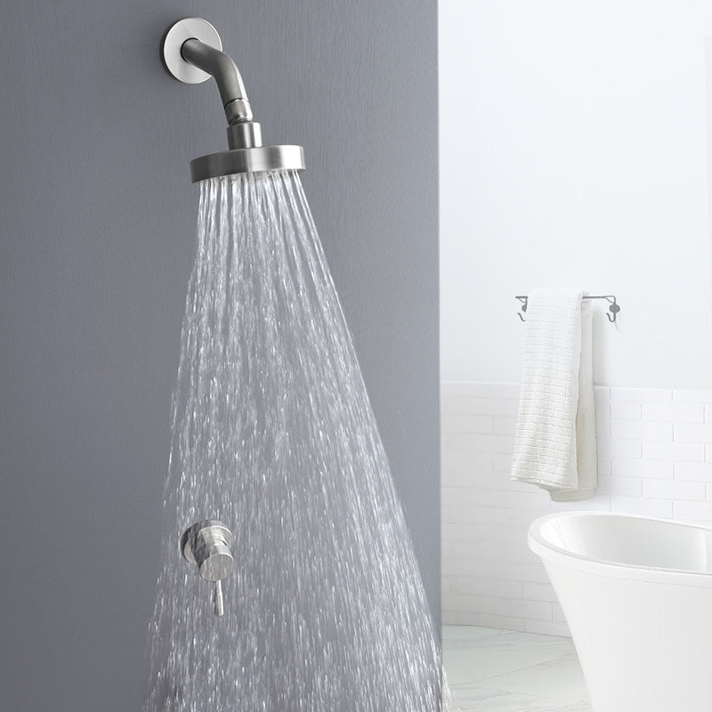 Stainless steel shower combination with round, fixed shower head and shower arm