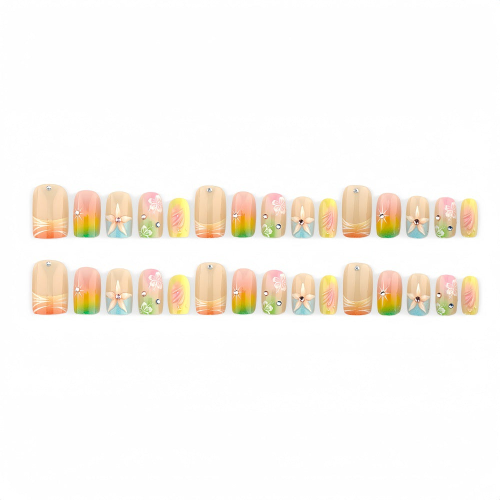 Artificial nails in vibrant floral design with glitter accents Acalora