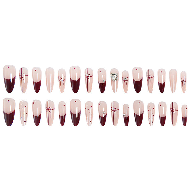 Artificial nail set with elegant bow and glitter details Acalora