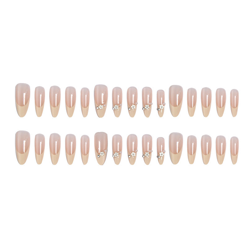 Acrylic nail set with elegant tips and sparkling appliqués Acalora