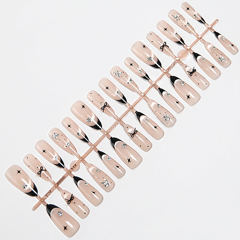Nail art set with elegant black and white design and sparkling applications Acalora