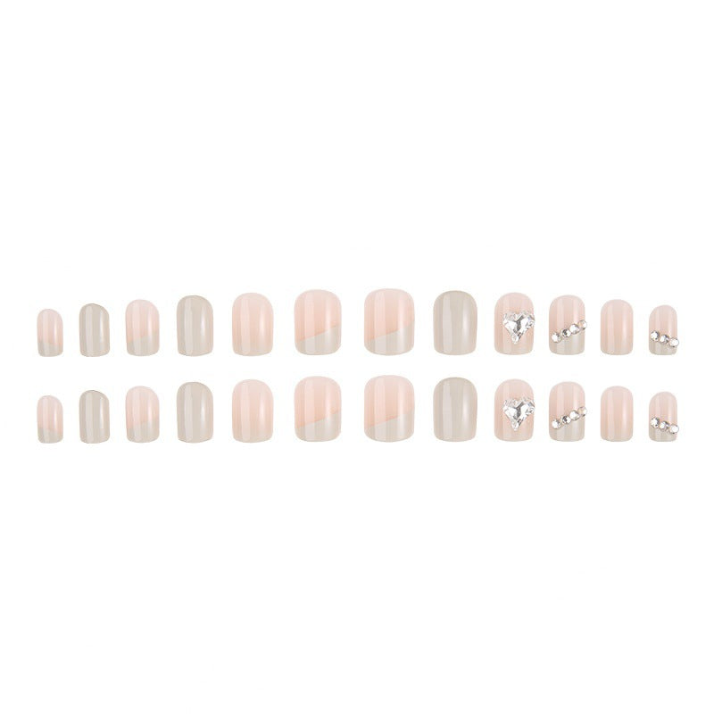 Glamorous artificial nails with heart and rhinestone decorations Acalora