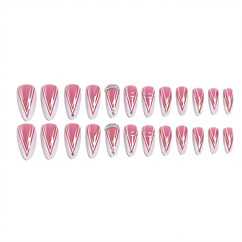 Acrylic nail set with elegant stiletto shape and luxurious embellishments Acalora