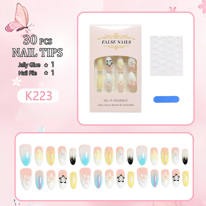 Artificial nail set with floral and glittering decorations Acalora