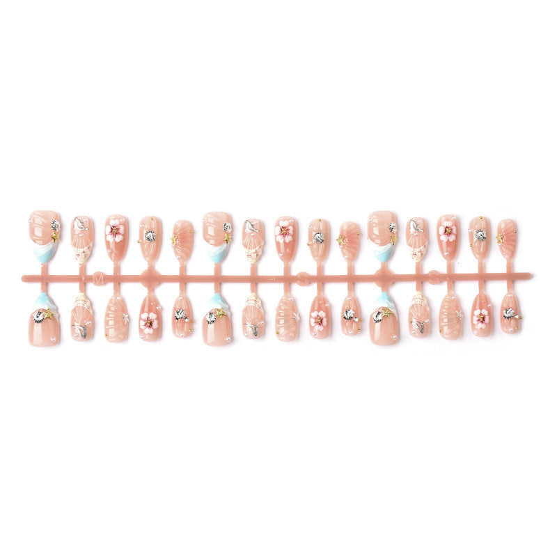Acrylic nail set with filigree shell and flower decorations Acalora