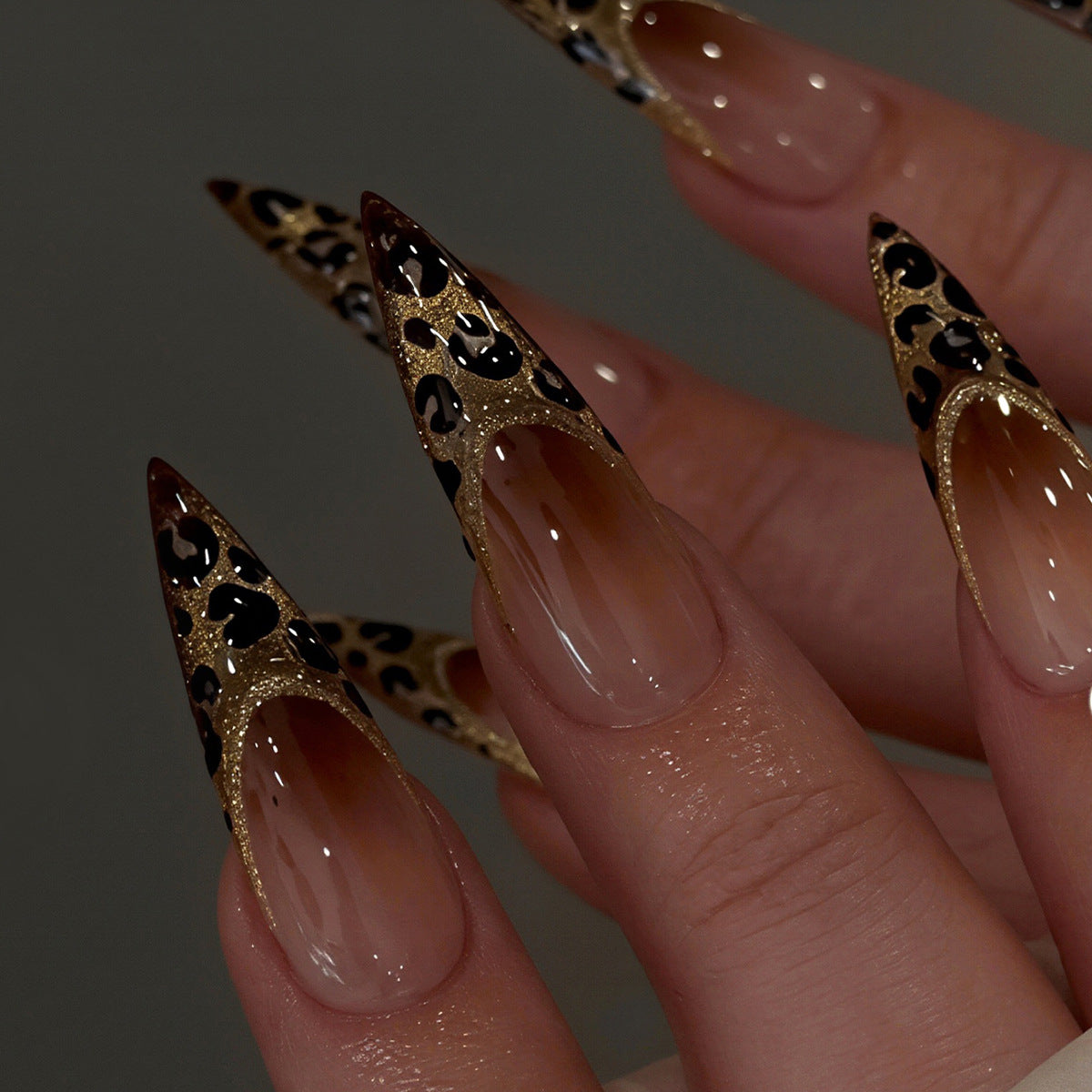 Elegant Stiletto Nail Art Set with Gold and Leopard Accents Acalora