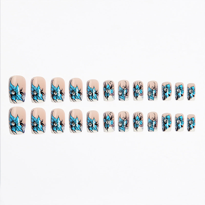 Artificial nail set with intricate floral designs and glitter elements Acalora