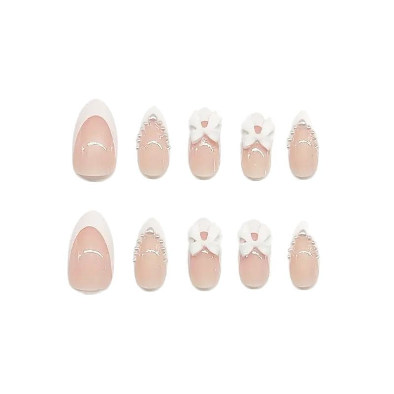 Artistic Press-On Nail Design with Bow Accents Acalora