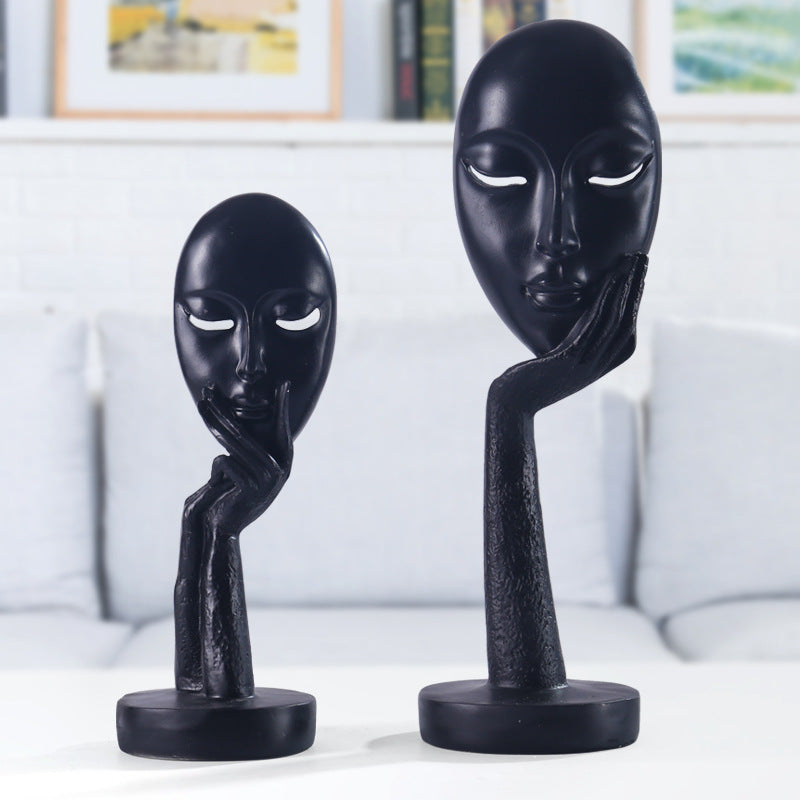 Artful decoration in the form of a thoughtful figure Acalora