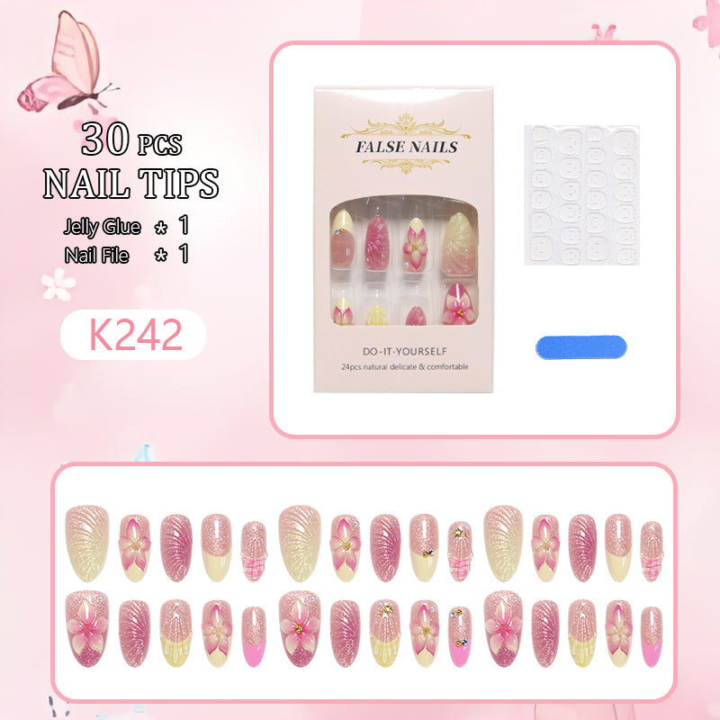 Art nail set with filigree flower decorations and glitter elements Acalora