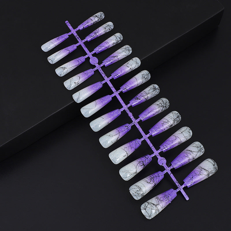 Artificial nails in modern ombre design with marbled accents Acalora