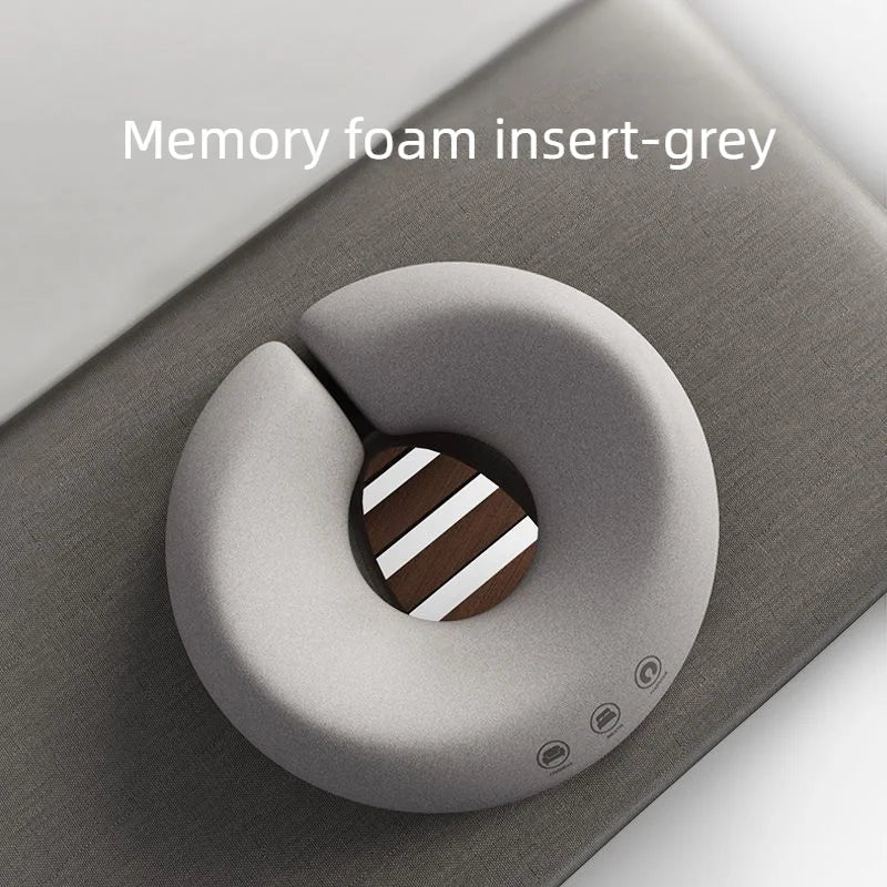 Ergonomic headrest cushion for massage table
