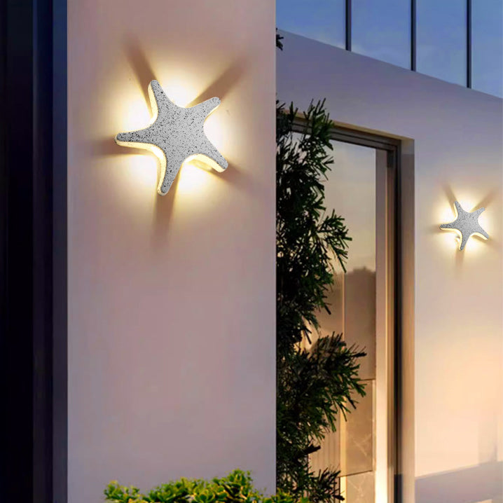 Modern, simple LED wall light made of aluminum in starfish design, waterproof, for the patio