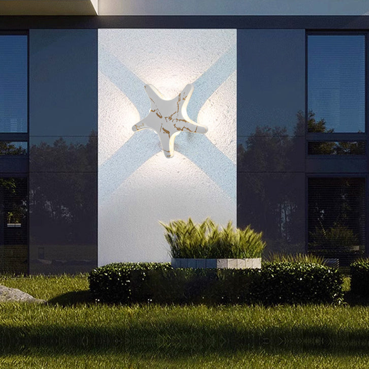 Modern, simple LED wall light made of aluminum in starfish design, waterproof, for the patio