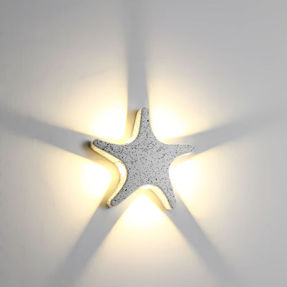 Modern, simple LED wall light made of aluminum in starfish design, waterproof, for the patio