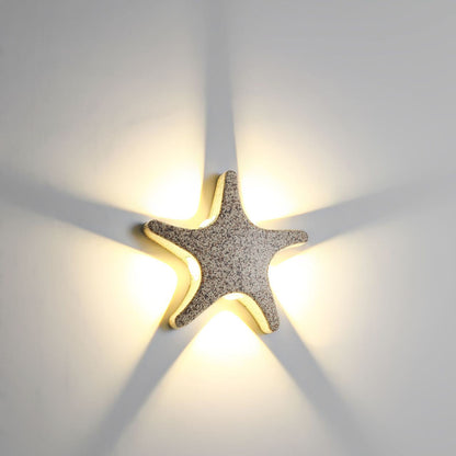 Modern, simple LED wall light made of aluminum in starfish design, waterproof, for the patio