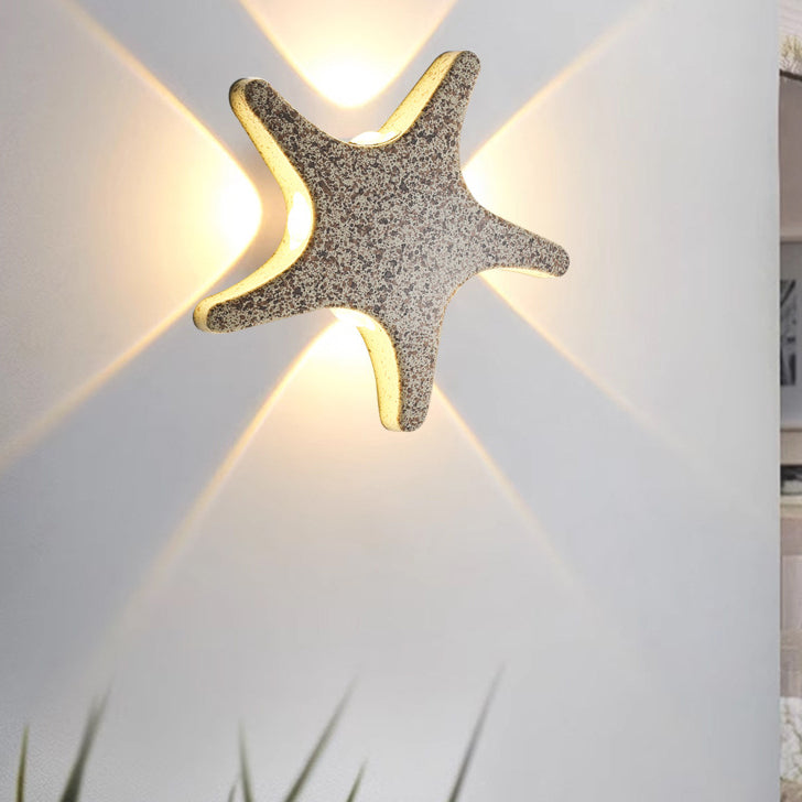 Modern, simple LED wall light made of aluminum in starfish design, waterproof, for the patio