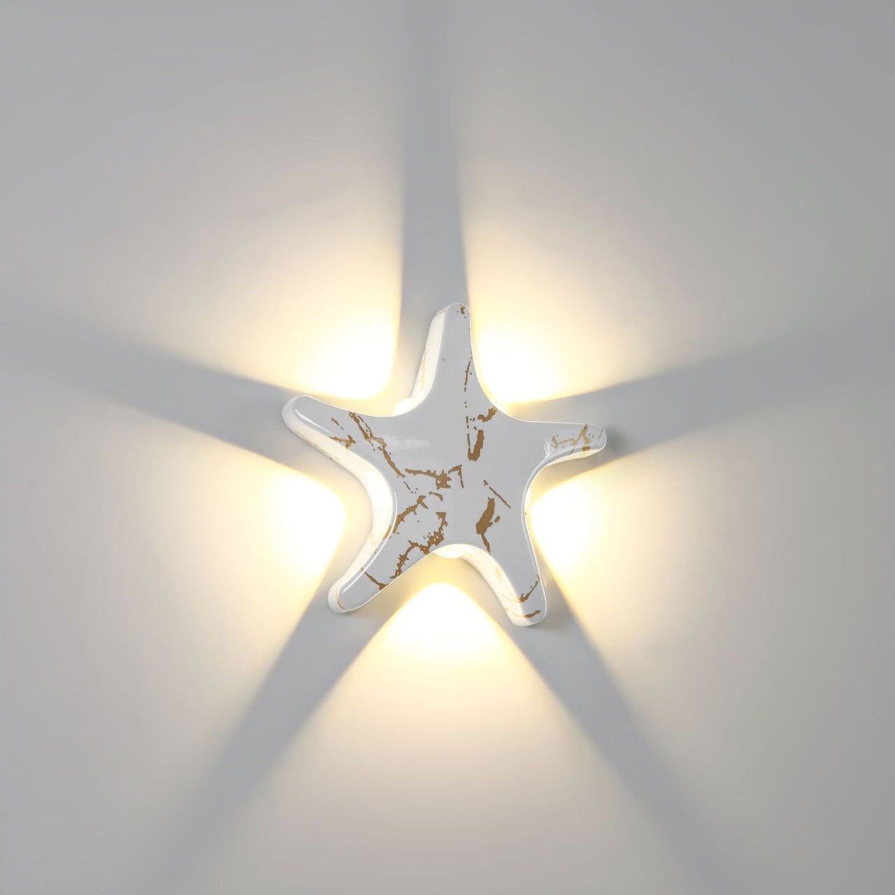 Modern, simple LED wall light made of aluminum in starfish design, waterproof, for the patio