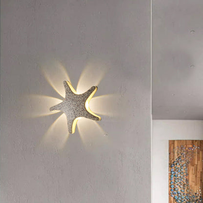 Modern, simple LED wall light made of aluminum in starfish design, waterproof, for the patio