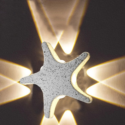 Modern, simple LED wall light made of aluminum in starfish design, waterproof, for the patio