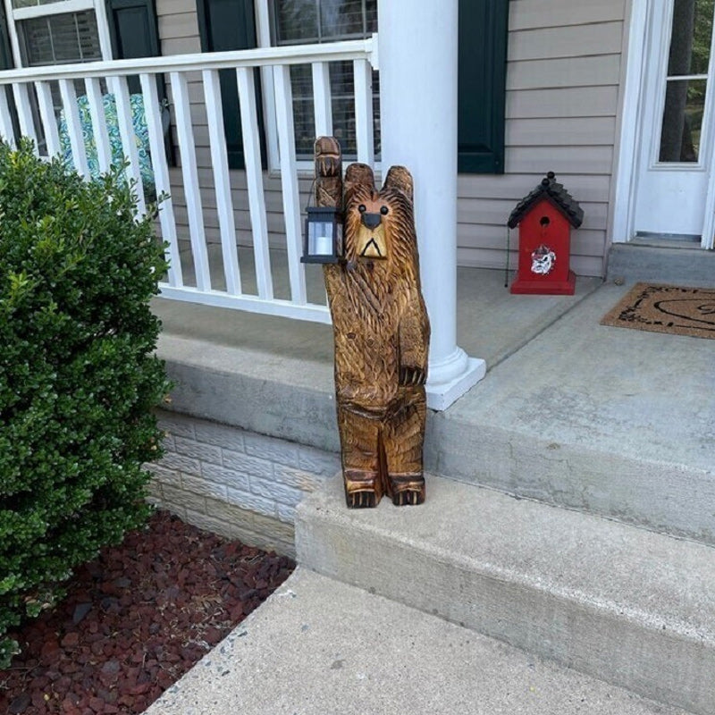 Cedar carved bear with solar lantern