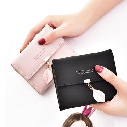 Short trifold wallet with leaf detail | Skanto
