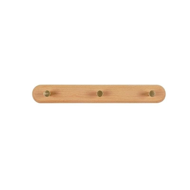 BowLift | WandHout – Minimalistic wooden wall coat rack with brass hooks