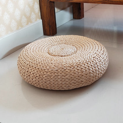 Handcrafted sitting pouf made of natural material Acalora