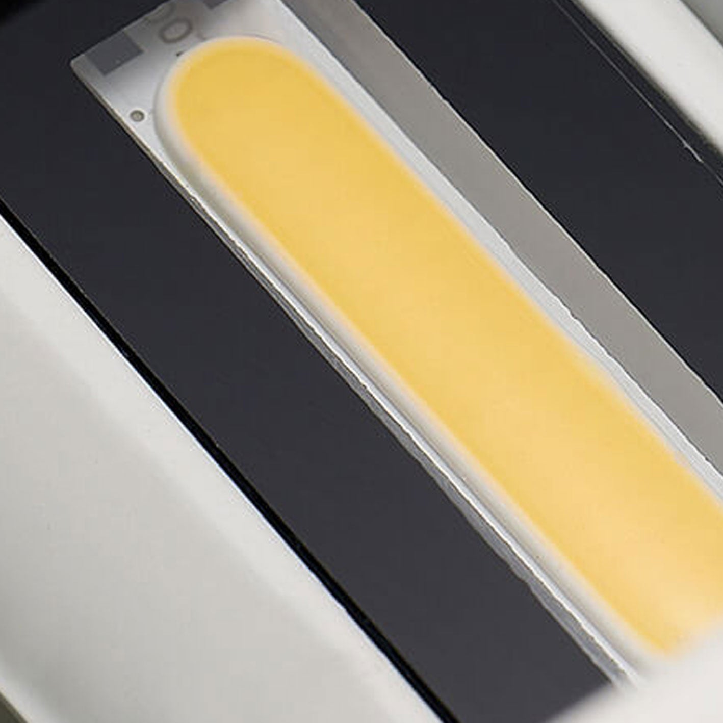 Modern, waterproof, rectangular outdoor LED wall light with up and down lighting.