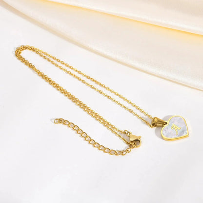 Skanto | 18k Pearl Heart Initial Necklace