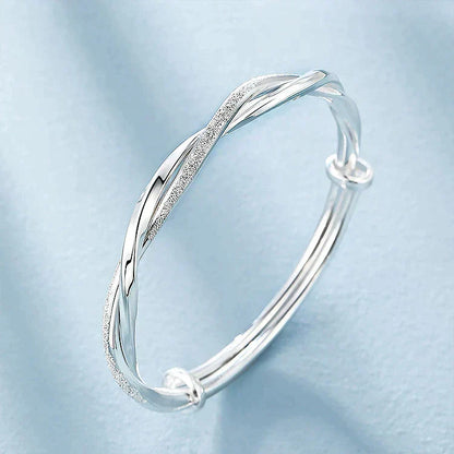 Elegant Twisted Silver Bracelet Bowlift
