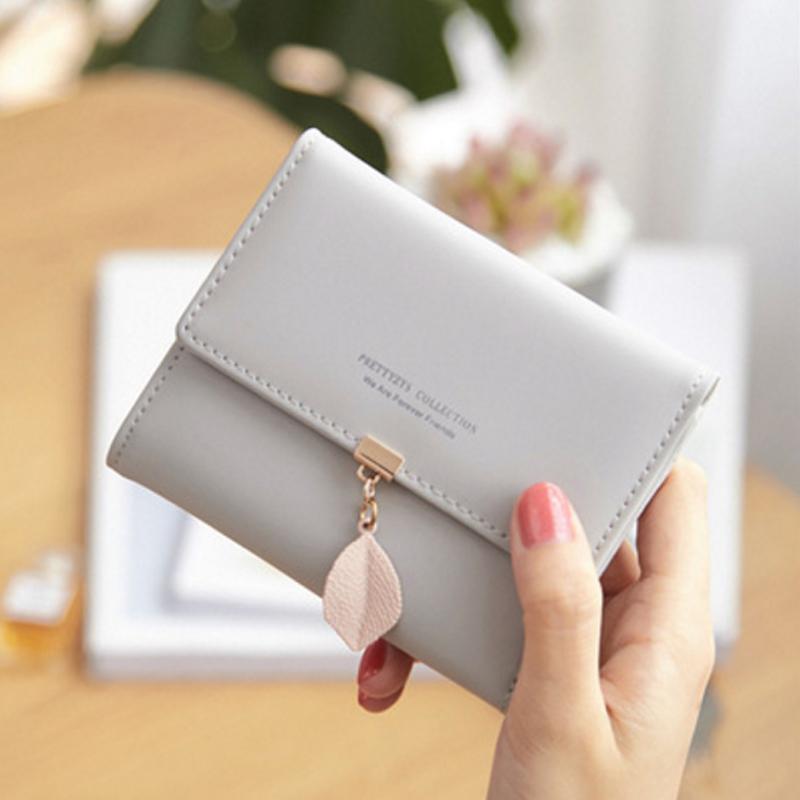 Short trifold wallet with leaf detail | Skanto
