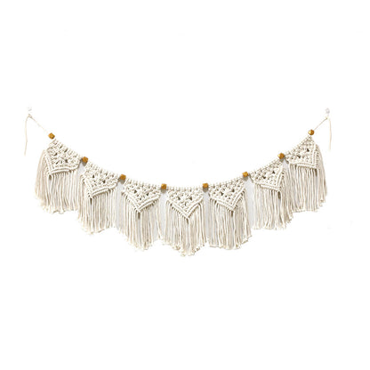 Decorative macrame wall hanging with ornate fringes