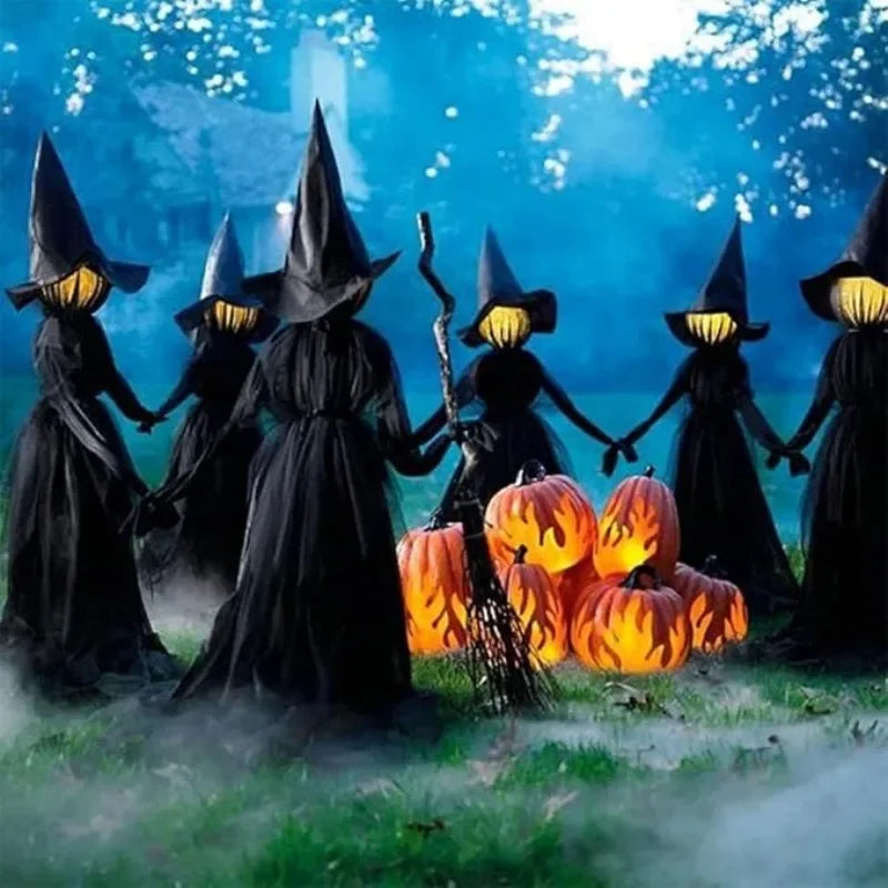 Glowing hand holds Halloween witch decoration