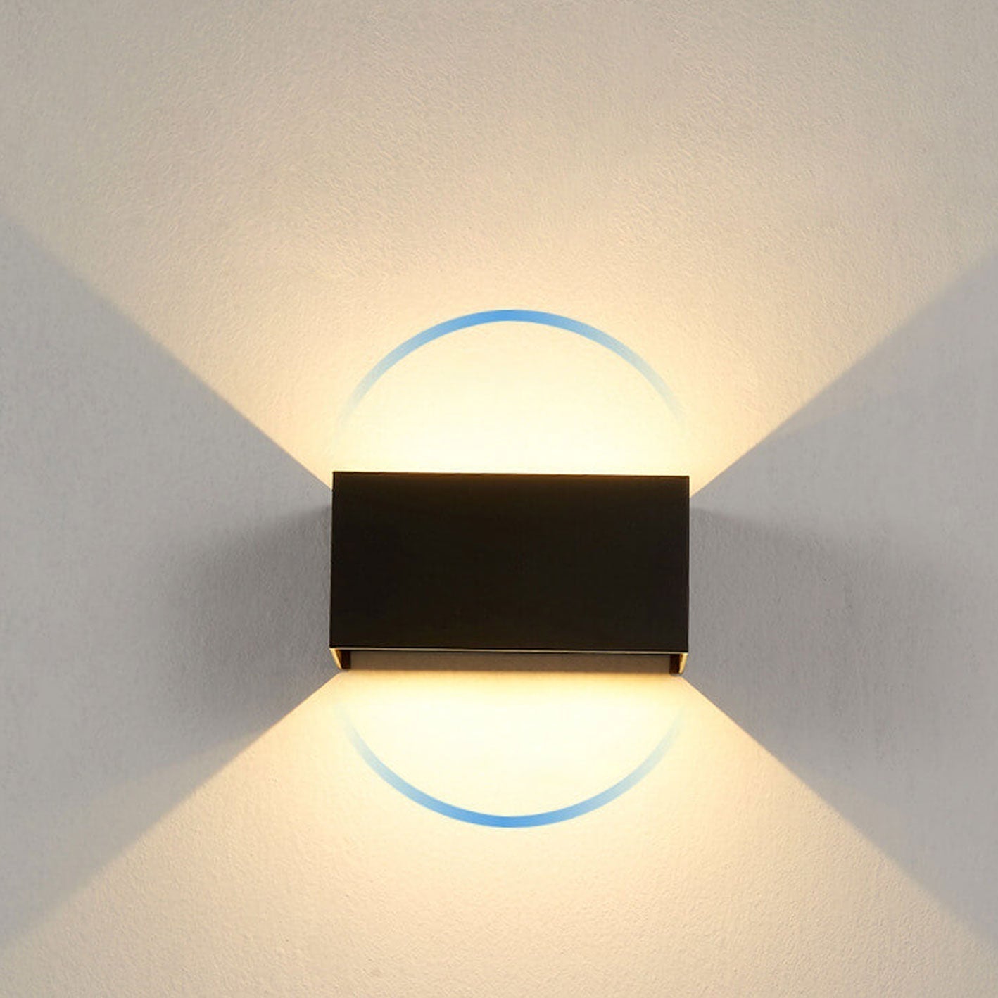 Modern, waterproof, rectangular outdoor LED wall light with up and down lighting.