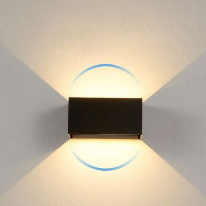 Modern, waterproof, rectangular outdoor LED wall light with up and down lighting.