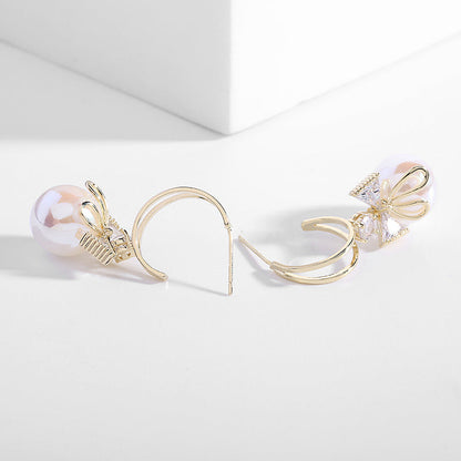 Skanto | Bow Pearl Earrings