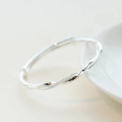 Elegant Twisted Silver Bracelet Bowlift