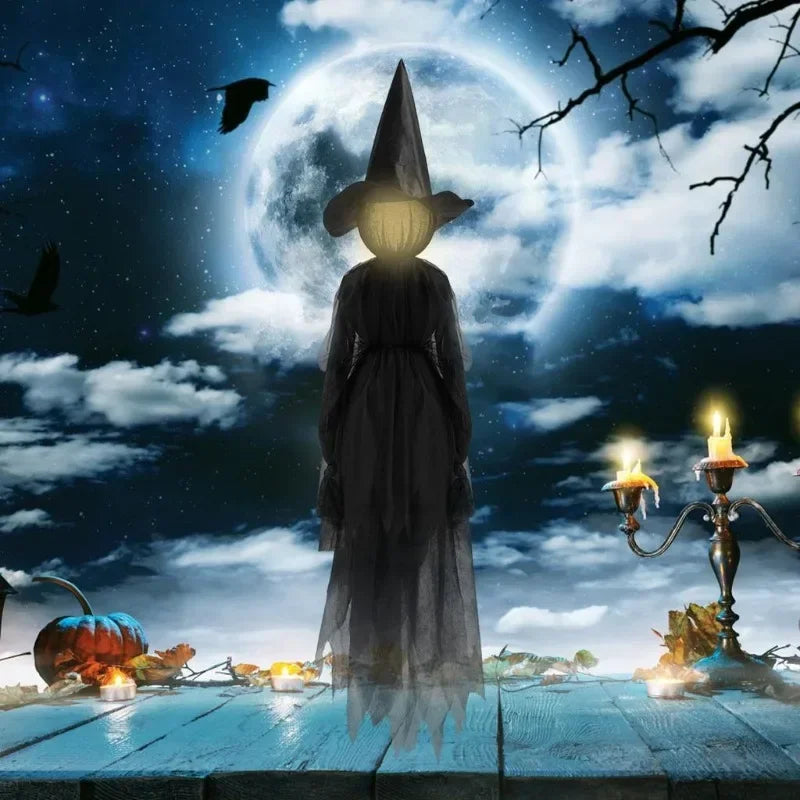 Glowing hand holds Halloween witch decoration