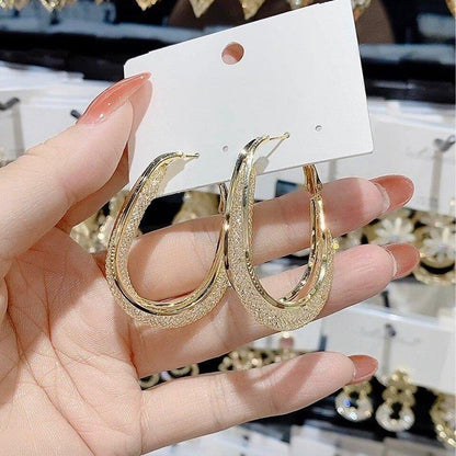 Skanto | Modern Cut Oval Earrings