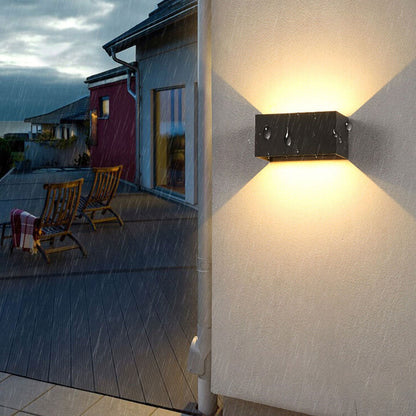 Modern, waterproof, rectangular outdoor LED wall light with up and down lighting.