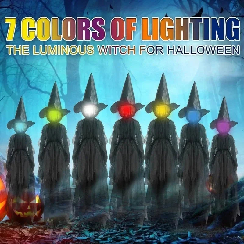 Glowing hand holds Halloween witch decoration