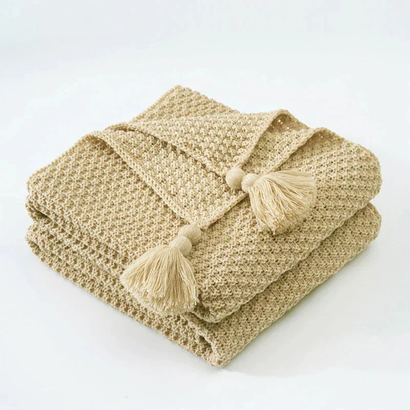 Cozy knitted wool blanket with elegant fringes