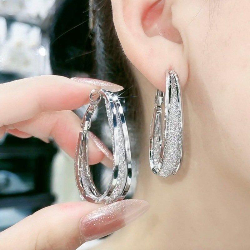 Skanto | Modern Cut Oval Earrings