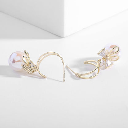 Skanto | Bow Pearl Earrings