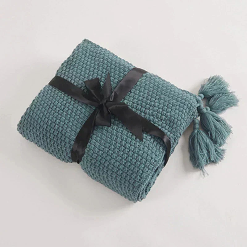 Cozy knitted wool blanket with elegant fringes