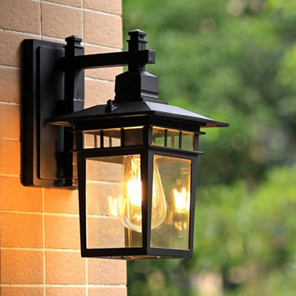 Traditional, rustic, rectangular wall lamp made of cast aluminum, iron, and glass with one light source for garden and patio