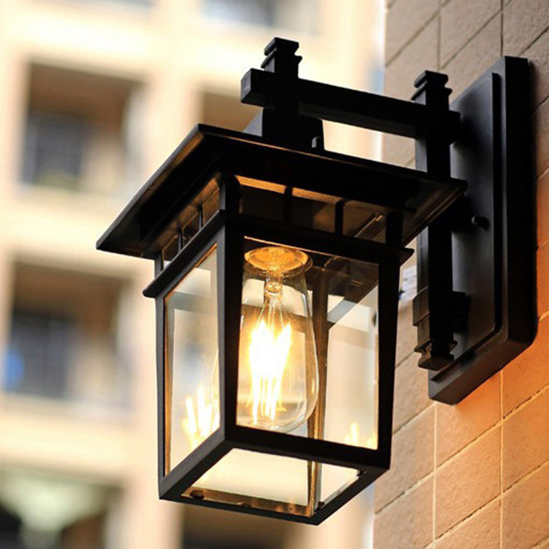 Traditional, rustic, rectangular wall lamp made of cast aluminum, iron, and glass with one light source for garden and patio