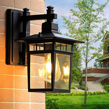 Traditional, rustic, rectangular wall lamp made of cast aluminum, iron, and glass with one light source for garden and patio