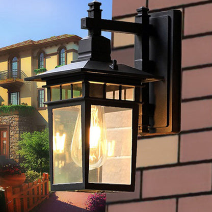 Traditional, rustic, rectangular wall lamp made of cast aluminum, iron, and glass with one light source for garden and patio